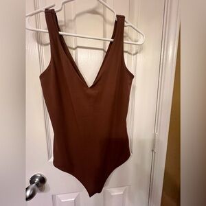 Express body contour brown v-neck bodysuit, size small.